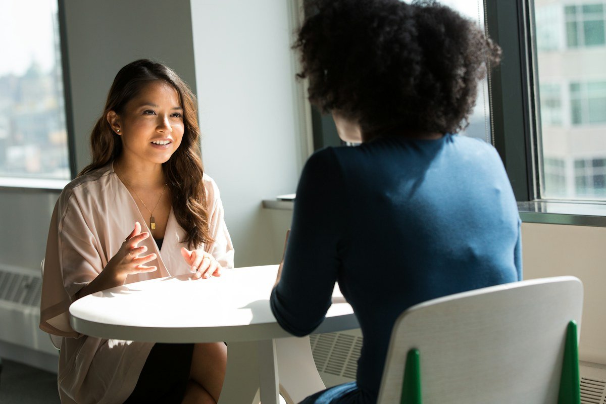 Two women in conversation during a work session