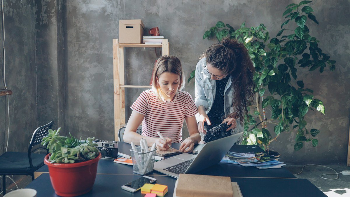 A designer and photographer discussing a creative project