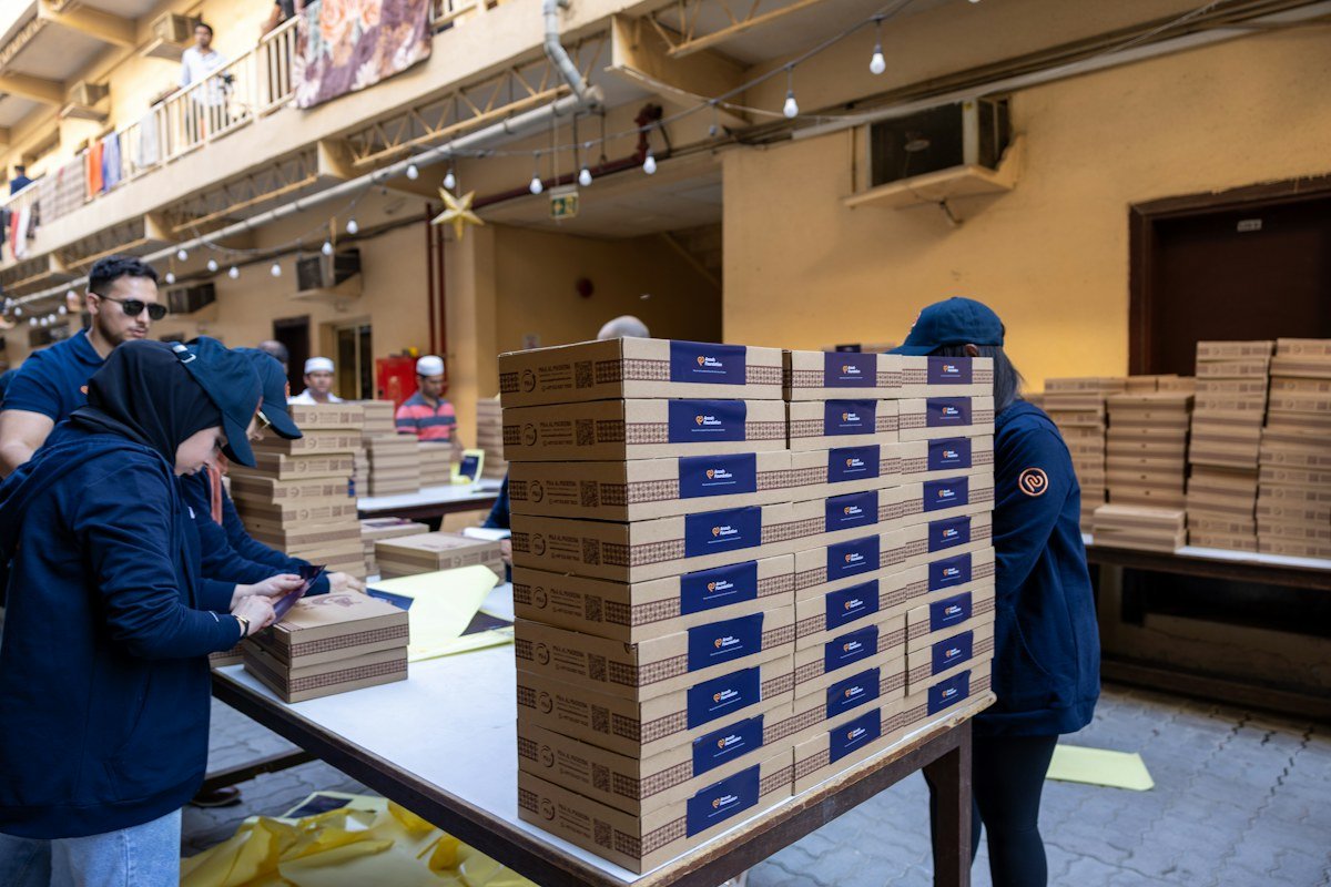 A team preparing parcels in a warehouse