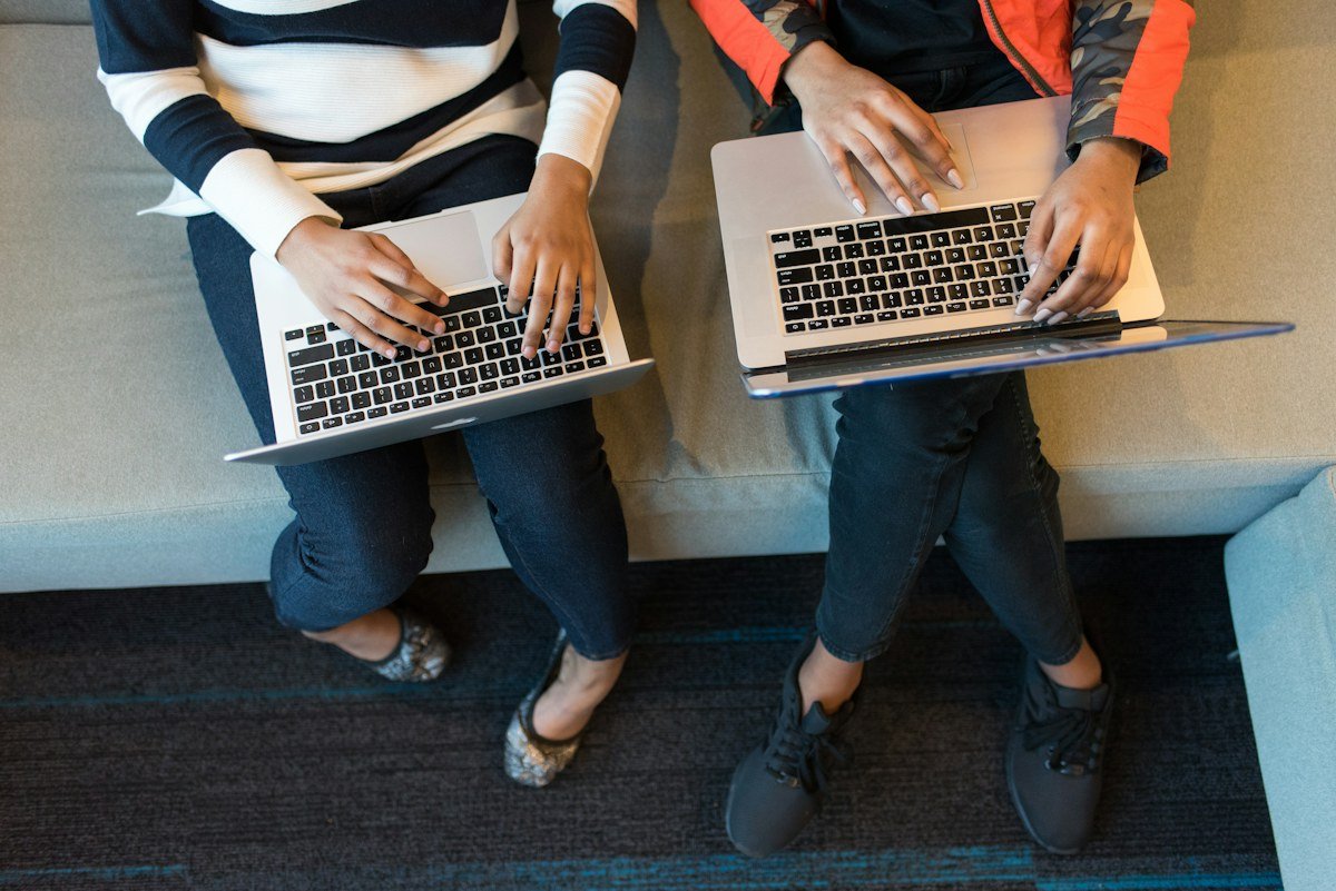 Colleagues working together at a laptop